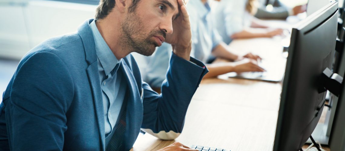 Programmers working in a software developing company office